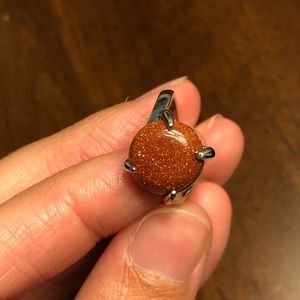 Stunning round goldstone ring, size 6 3/4.